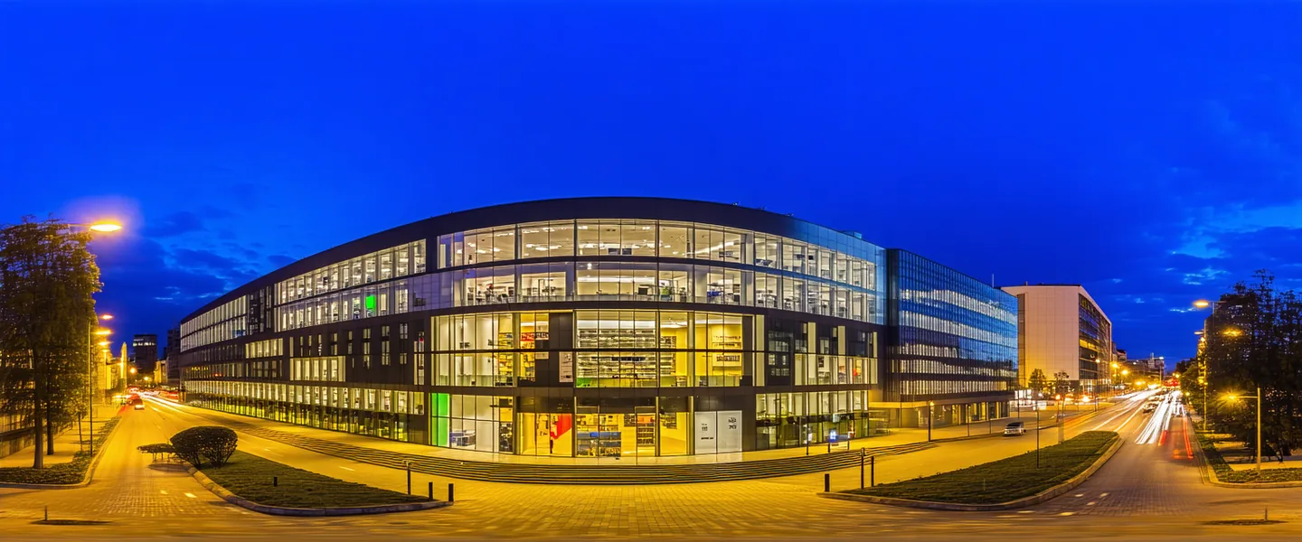 Munich cityscape at dusk with modern office buildings and infrastructure, representing the company's European roots